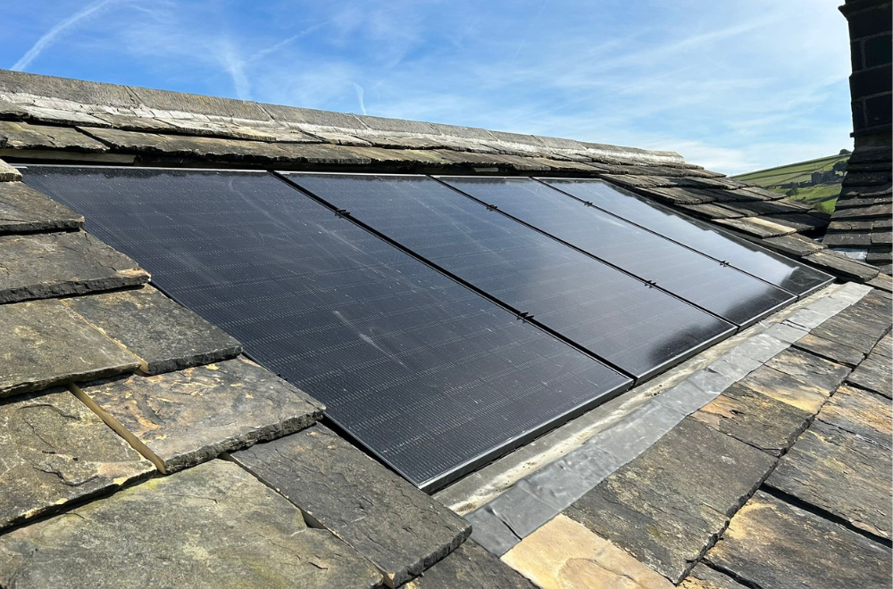 Stone tiled roof with inset solar panels.