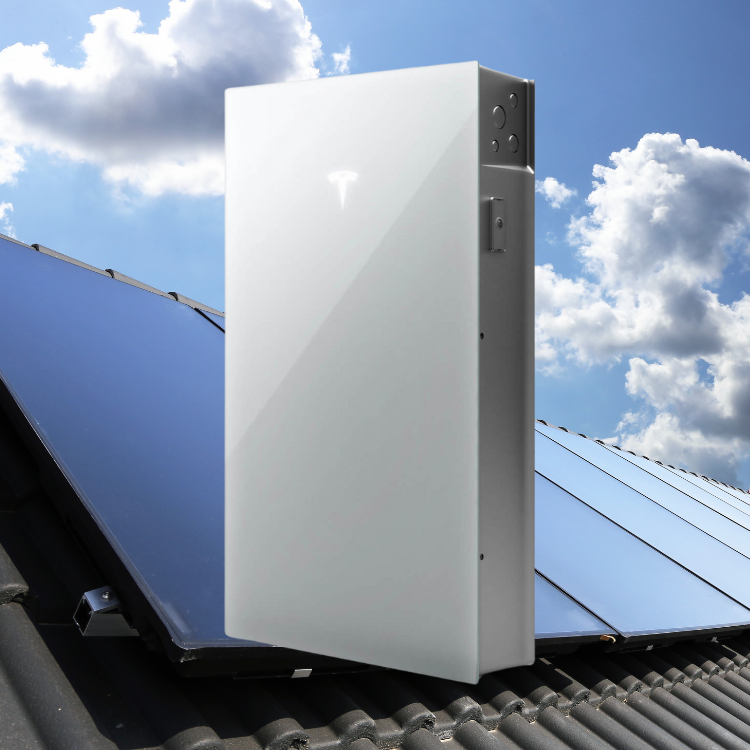 Tesla PW 3 solar panels on a roof and blue sky and clouds behind.