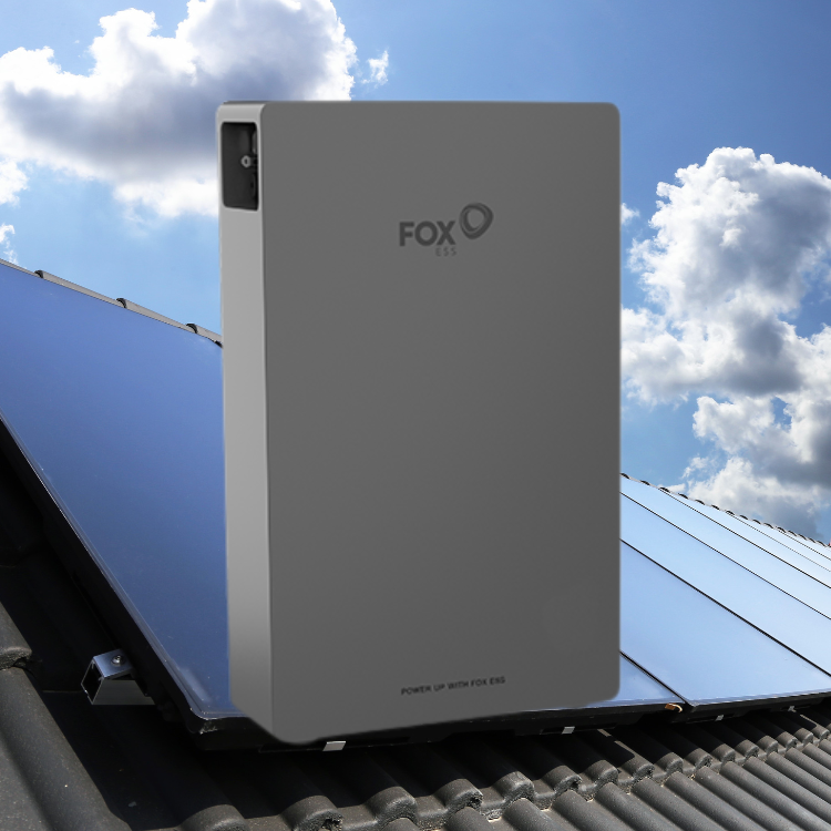 Fox ESS Battery with a roof with solar panels on the back with blue skies and clouds in the background