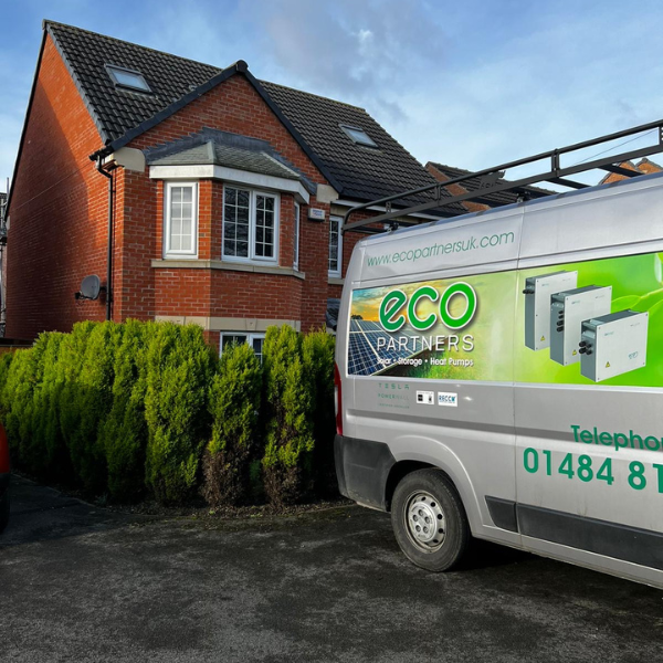 An Image of a house with the Eco Partners Sodium Battery Storage installer's van parked outside.
