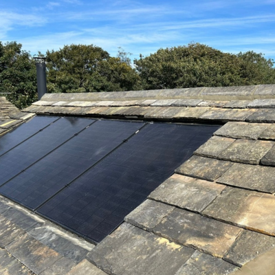 New stone roof with in-roof solar PV. installed by Eco Partners Bradford.