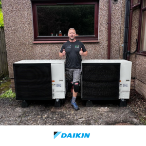 Eco Partners engineer with a two-unit Daikin cascade heat pump system