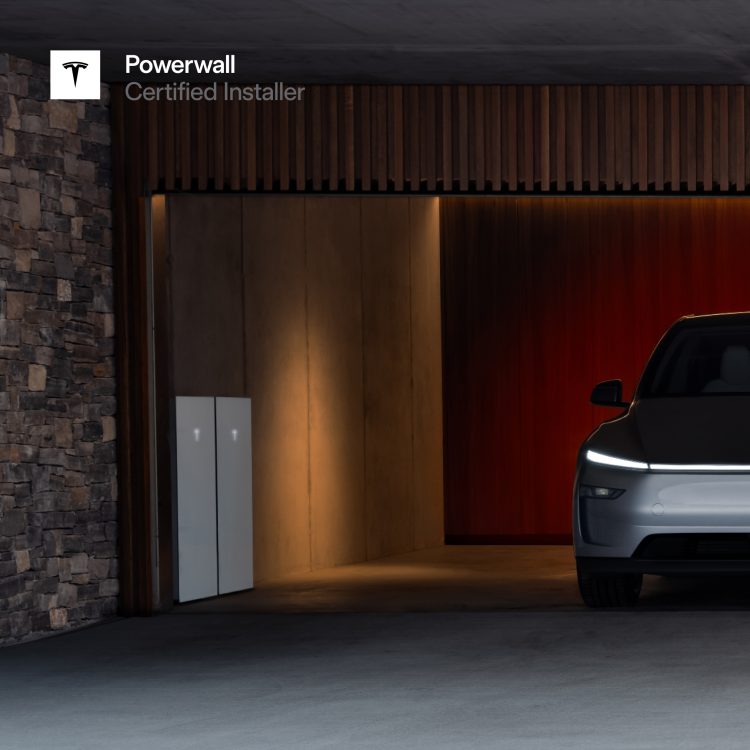 Image of a silver Tesla Car inside a garage with 2 Tesla Powerwall 3 batteries on the wall at the side